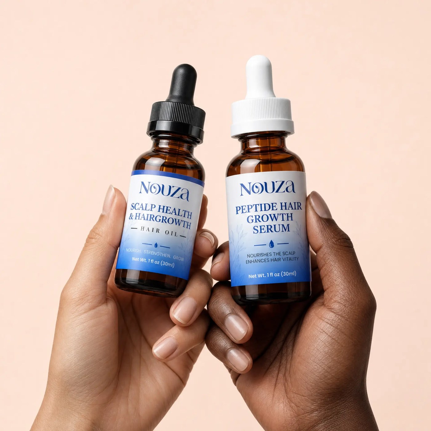 Two women holding the NOUZA Hair Oil and the Peptide Hair Growth Serum
